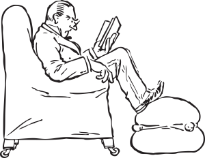 Man-Reading-Book-While-Sitting-In-Chair